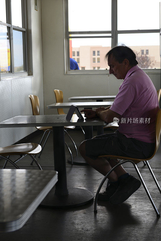 Man Working W Digital Tablet inside Cafè